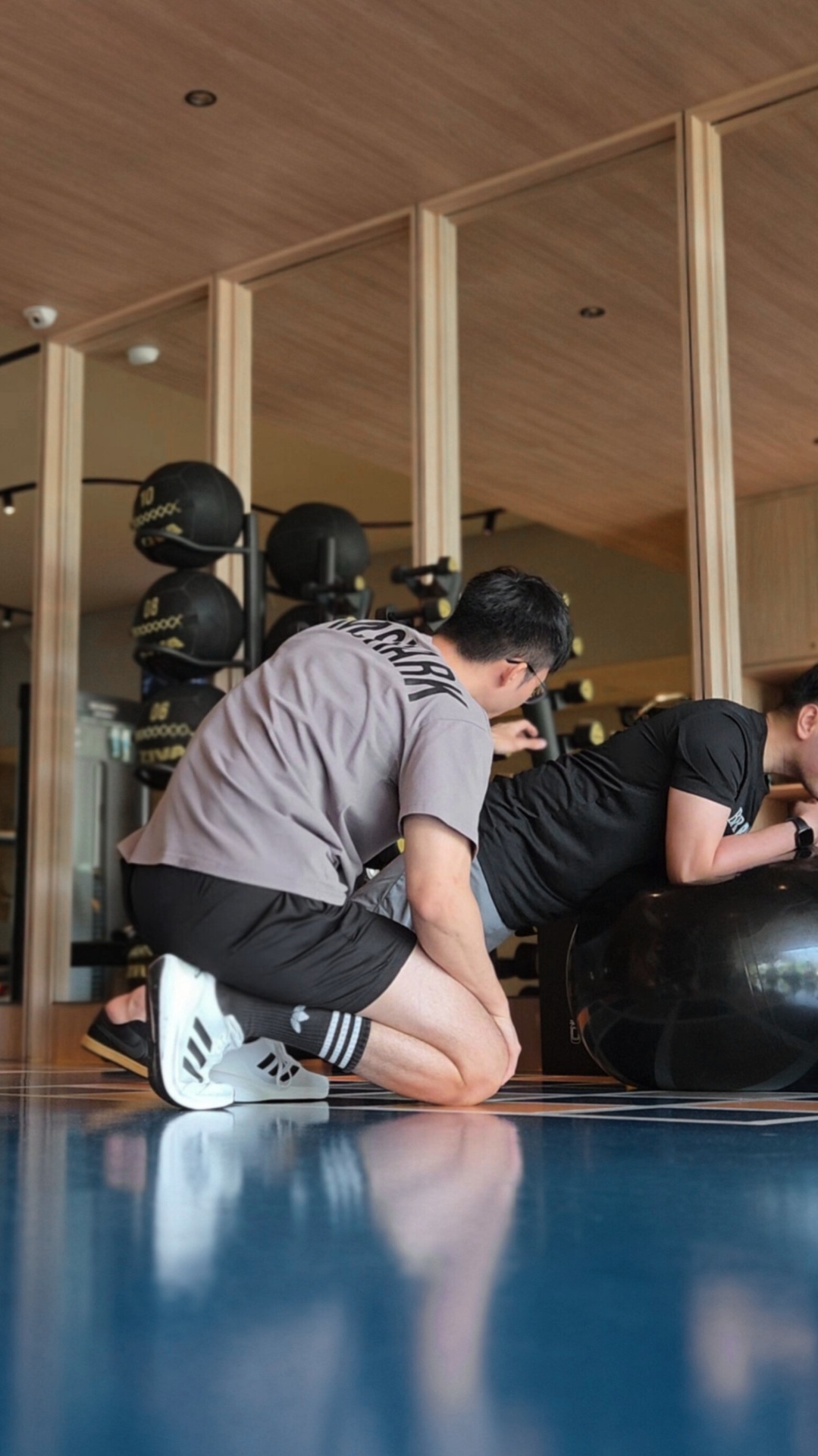 Matthew spotting a client through a bench press set